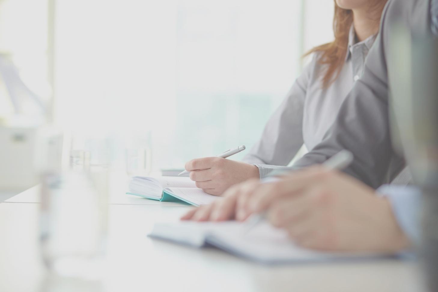 Students engaged in collaborative learning session with financial charts and market analysis tools